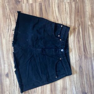 Levi’s vintage black denim mini skirt.